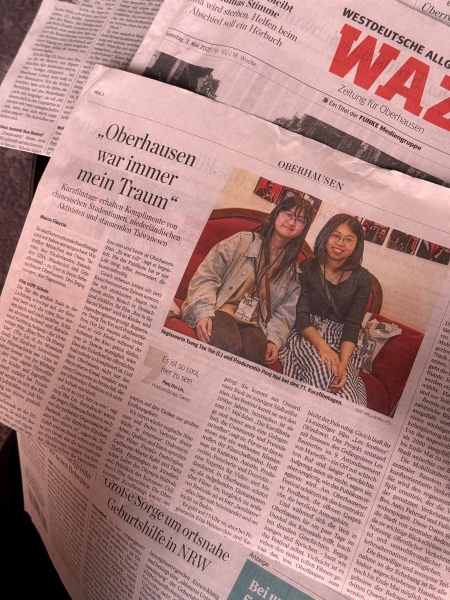曾子晏「《秘密森林少年》入選第71屆奧伯豪森國際短片影展(International Short Film Festival Oberhausens)放映暨交流計畫」:當地新聞報紙,圖為導演曾子晏與製片林芃蕙